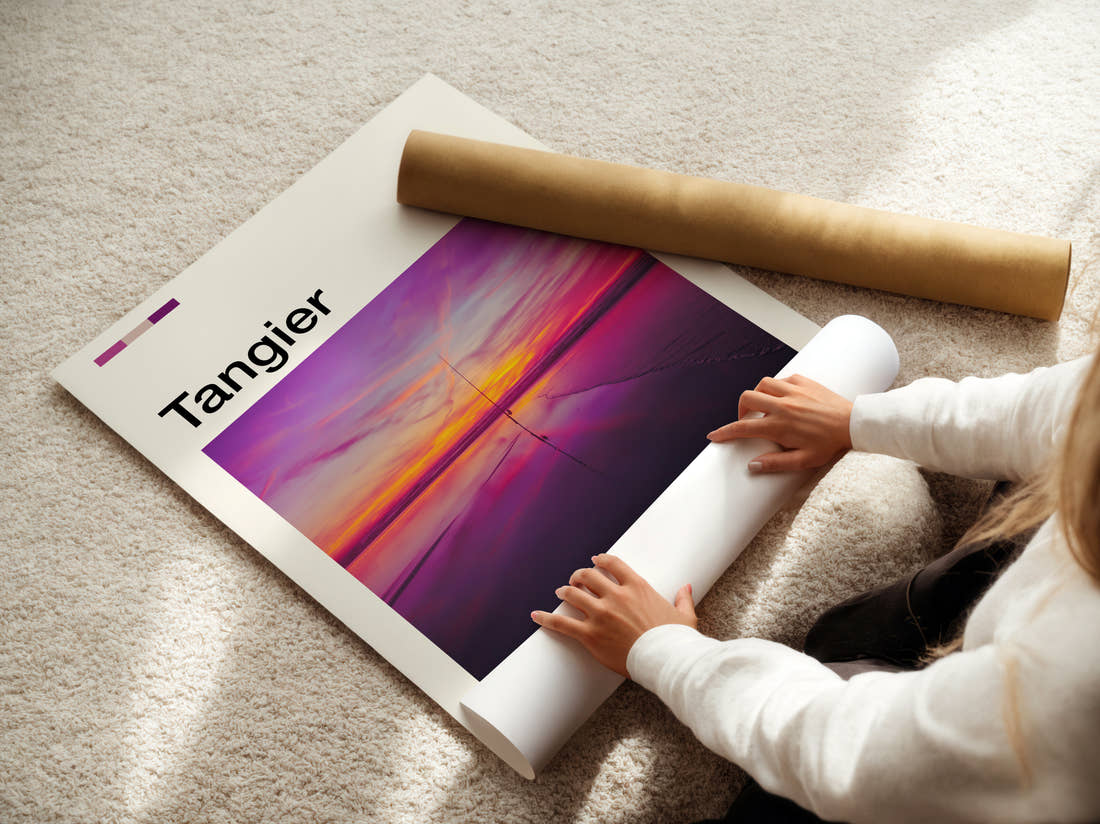 Tangier Pink Sunset Over Water Travel Print being unrolled from its postal tube