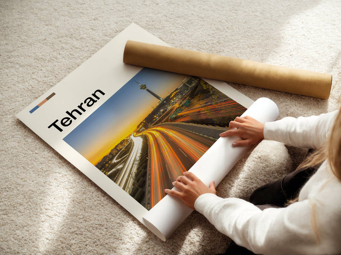 Tehran Traffic Light Trails Travel Print being unrolled from its postal tube