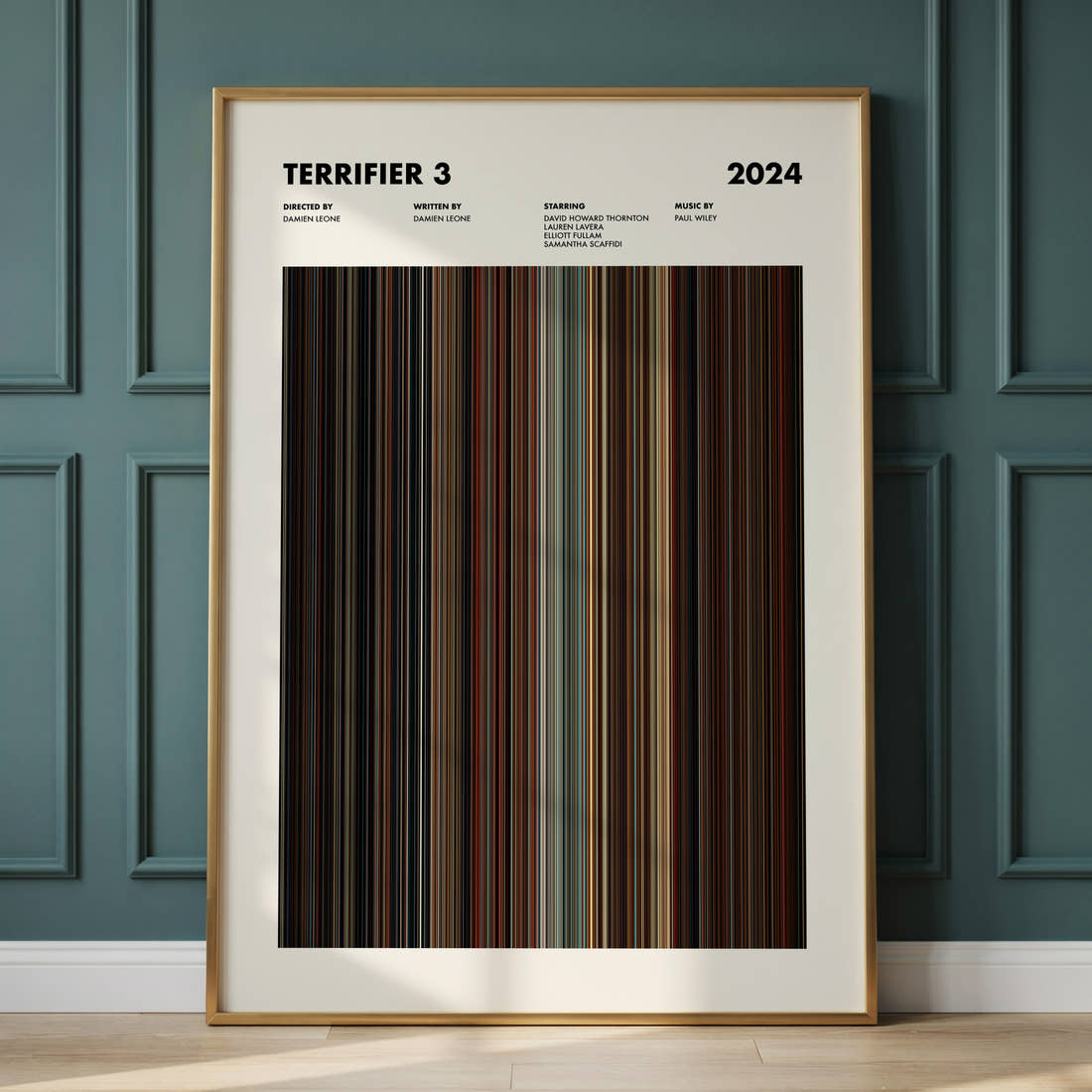 Terrifier 3 Movie Barcode Poster framed and leaning against a panelled wall