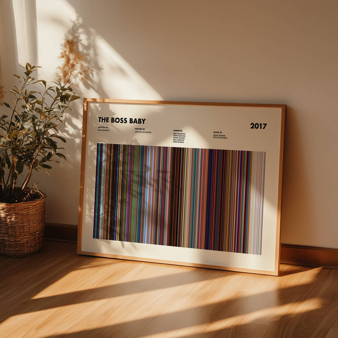 The Boss Baby Movie Barcode Poster framed and leaning against a wall on a wooden floor