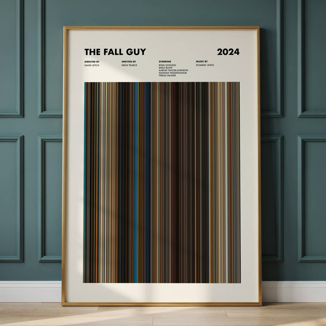 The Fall Guy Movie Barcode Poster framed and leaning against a panelled wall