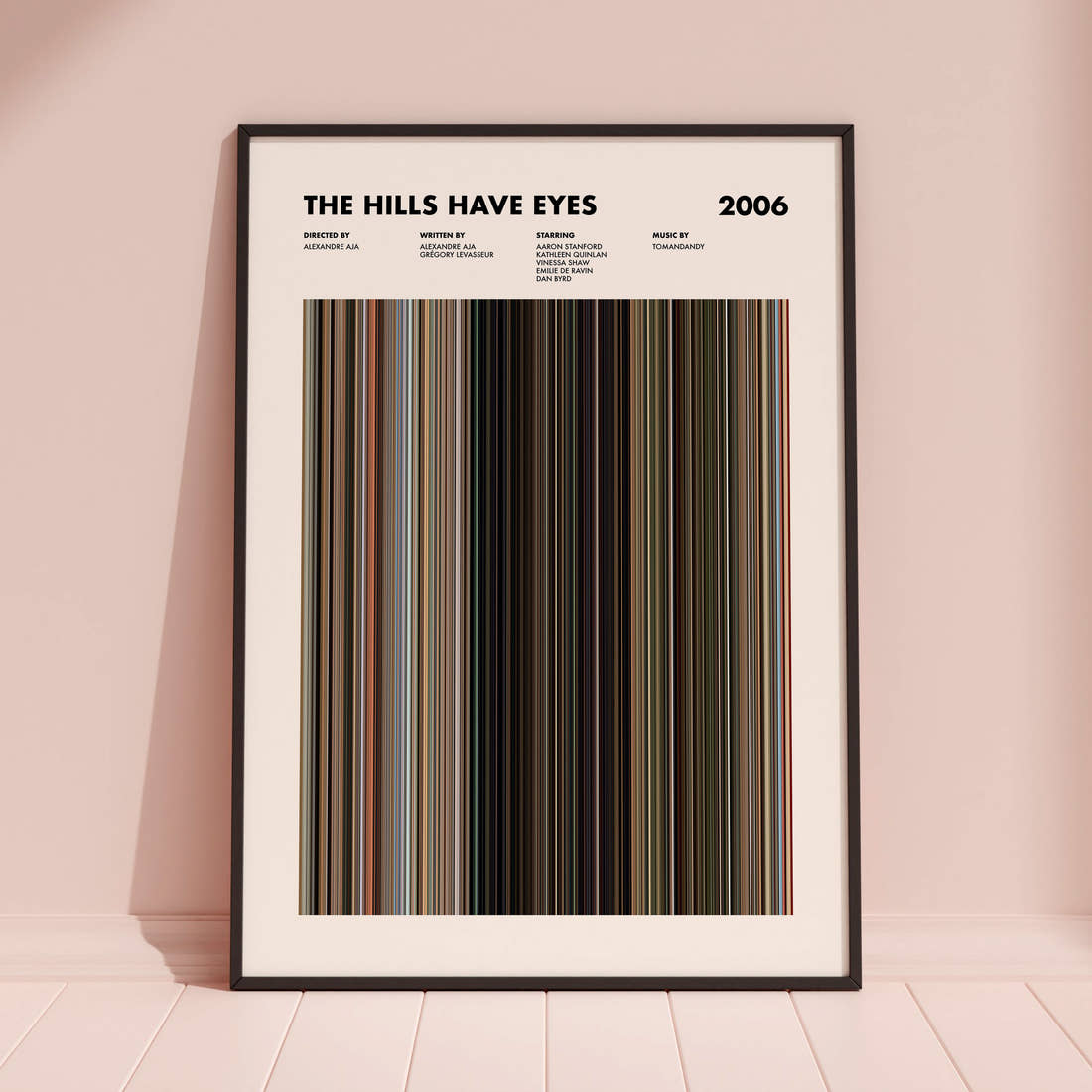 The Hills Have Eyes Movie Barcode Poster framed and leaning against a coloured wall