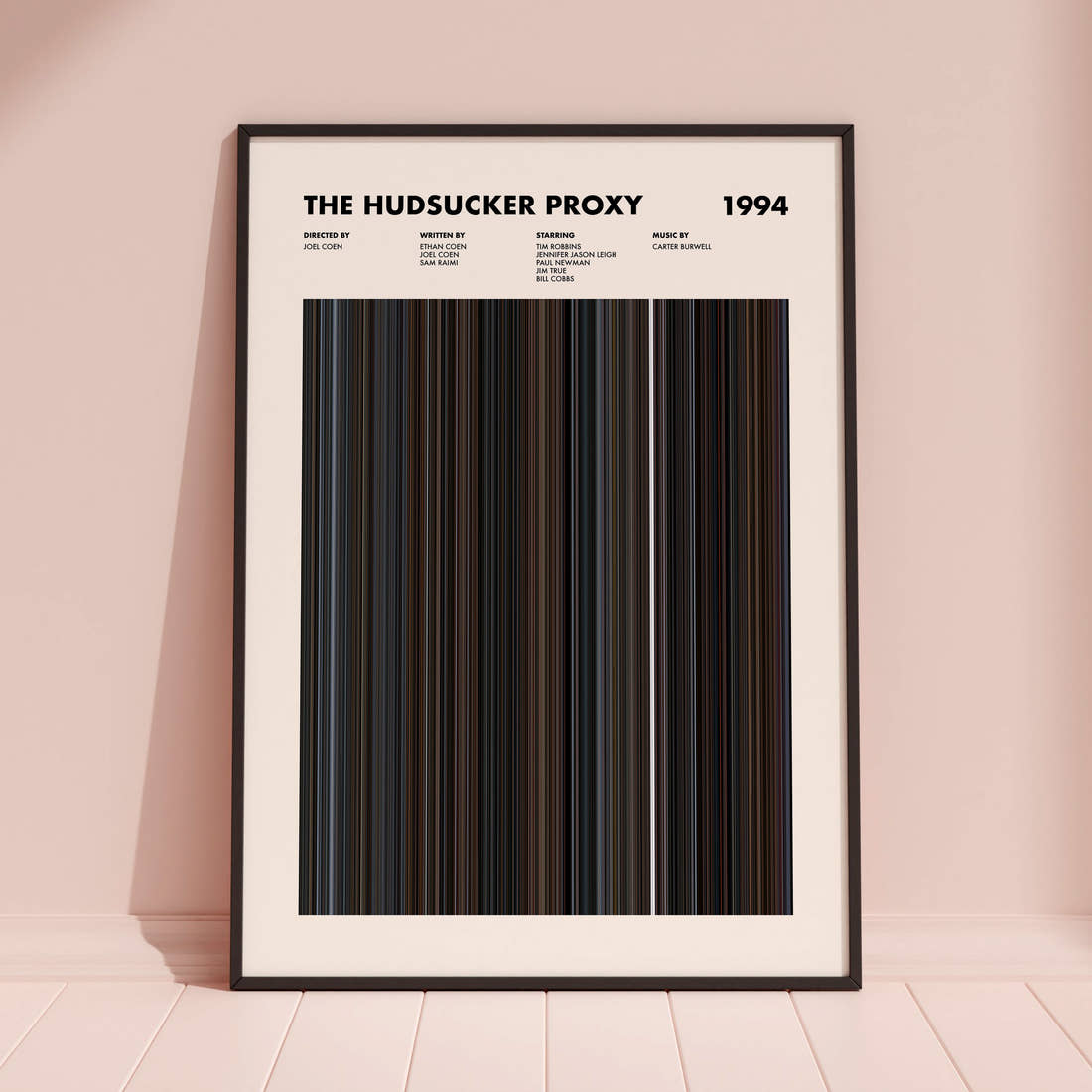 The Hudsucker Proxy Movie Barcode Poster framed and leaning against a coloured wall