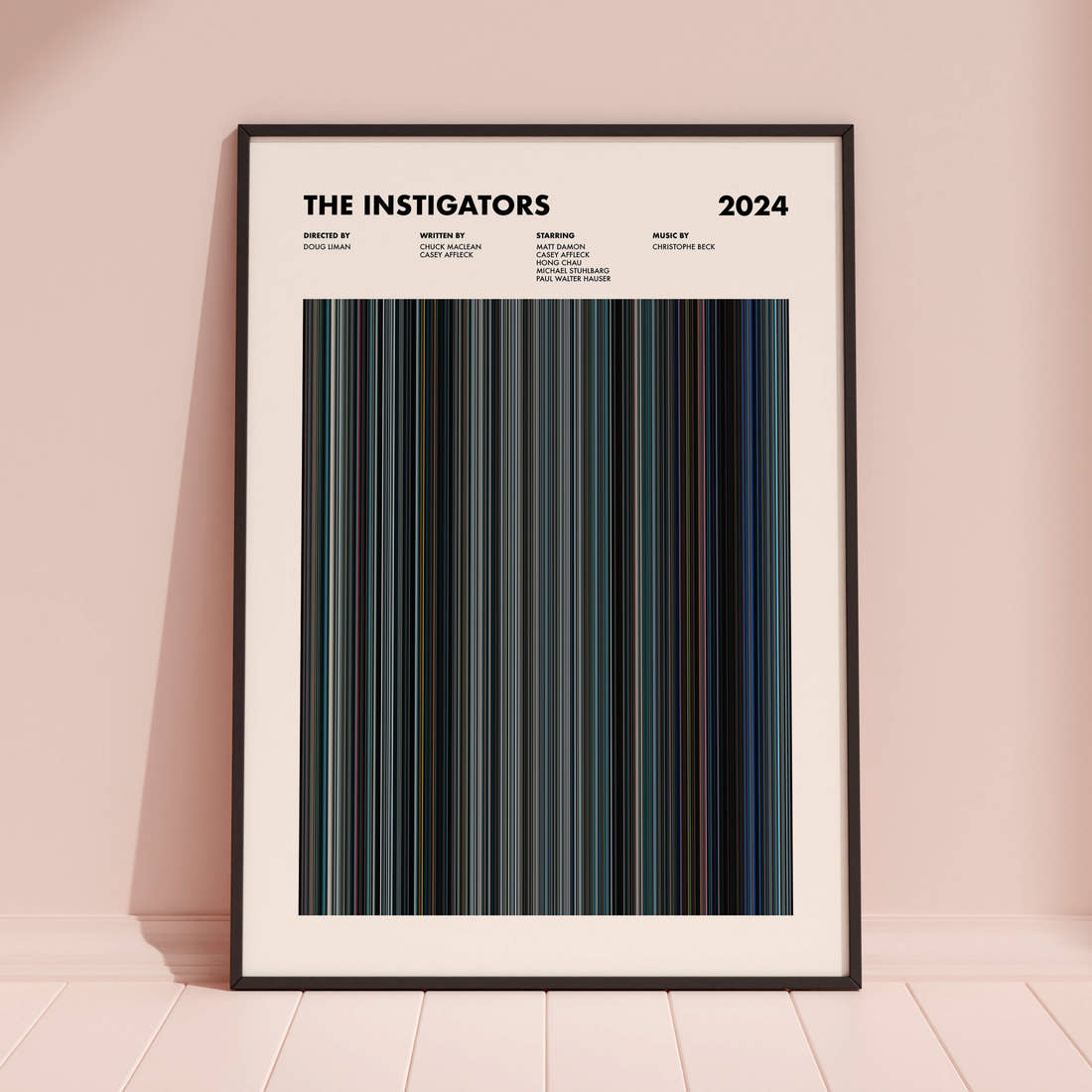 The Instigators Movie Barcode Poster framed and leaning against a coloured wall