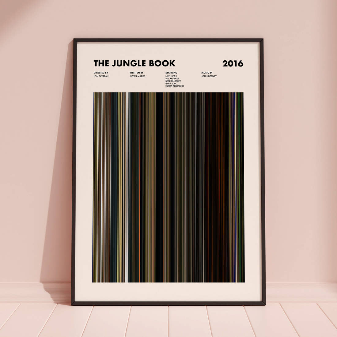 The Jungle Book (2016) Movie Barcode Poster framed and leaning against a coloured wall