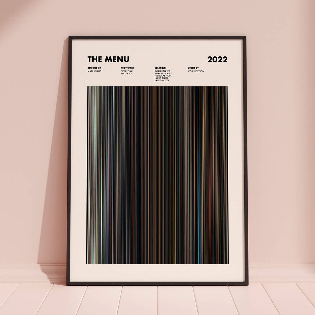 The Menu Movie Barcode Poster framed and leaning against a coloured wall