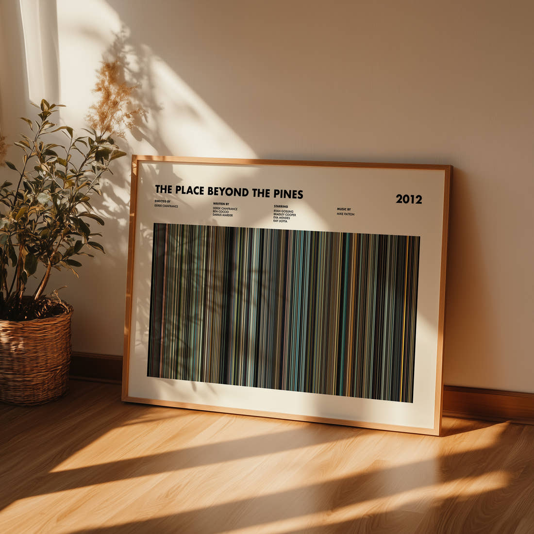 The Place Beyond The Pines Movie Barcode Poster framed and leaning against a wall on a wooden floor