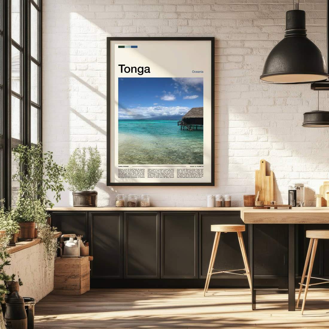 Tonga Overwater Bungalow, Lagoon Travel Print framed on the wall of a bright kitchen and dining space