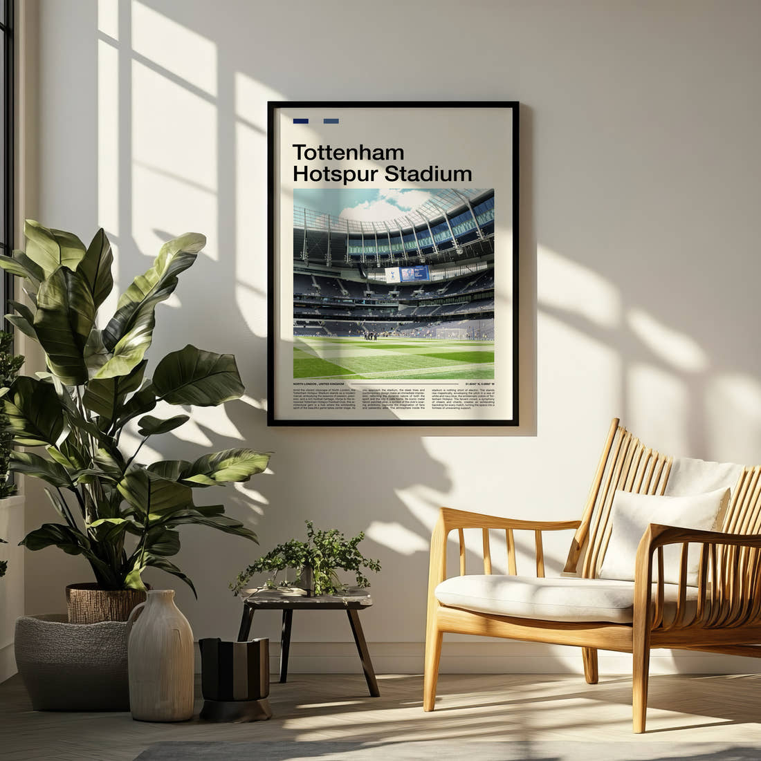 Tottenham Hotspur Stadium Print framed on a pale wall beside houseplants