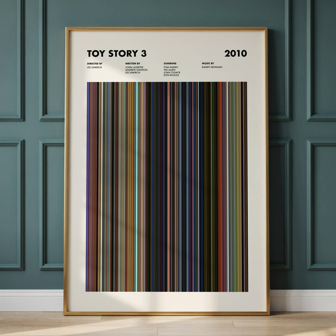 Toy Story 3 Movie Barcode Poster framed and leaning against a panelled wall