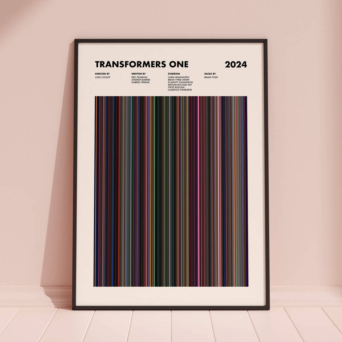 Transformers One Movie Barcode Poster framed and leaning against a coloured wall