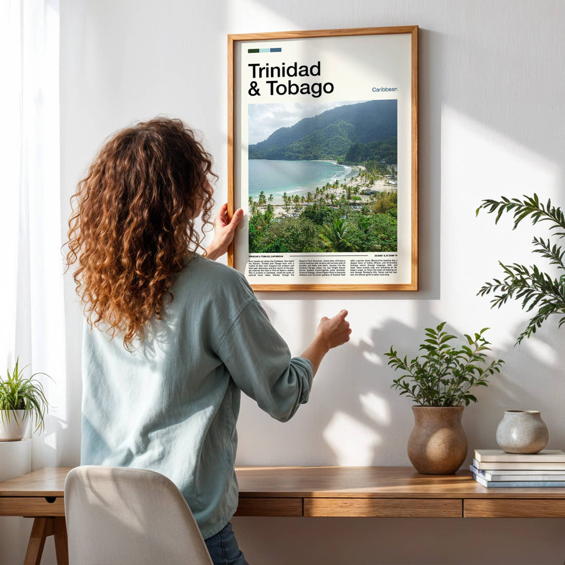 Trinidad & Tobago Coastal Bay Overlook Travel Print framed on a pale wall beside houseplants
