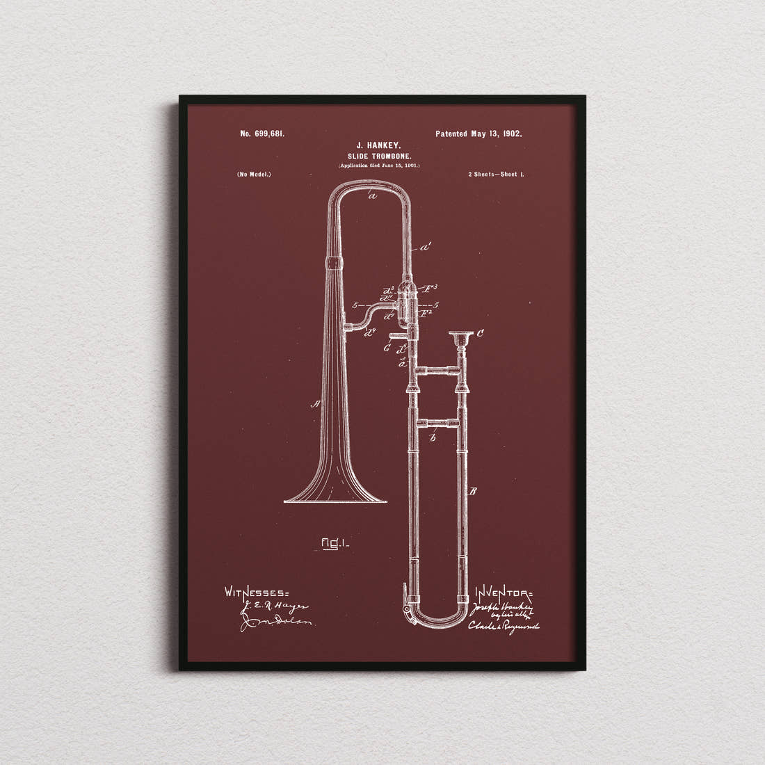 Trombone Patent Print in the burgundy colourway, framed