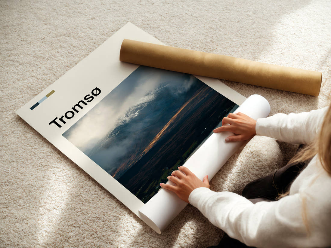 Tromsø Cloud-Wrapped Peak Travel Print being unrolled from its postal tube