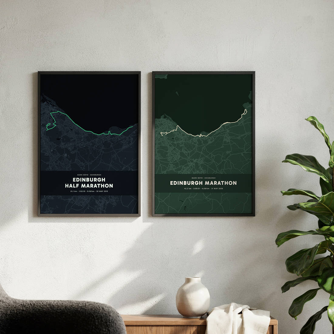 Two custom running map prints hanged side by side on wall