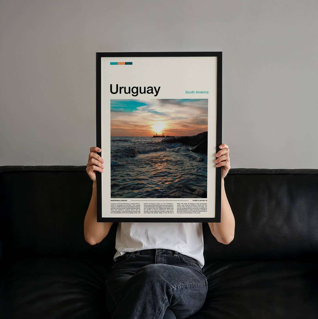 Uruguay Sunset Over The Sea Travel Print held up by hand to show the size of the print