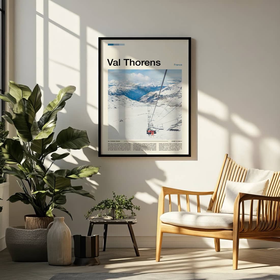 Val Thorens Chairlift Over Piste Travel Print framed on a pale wall beside houseplants