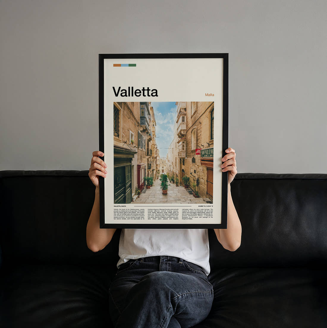 Valletta Narrow Street Travel Print held up by hand to show the size of the print