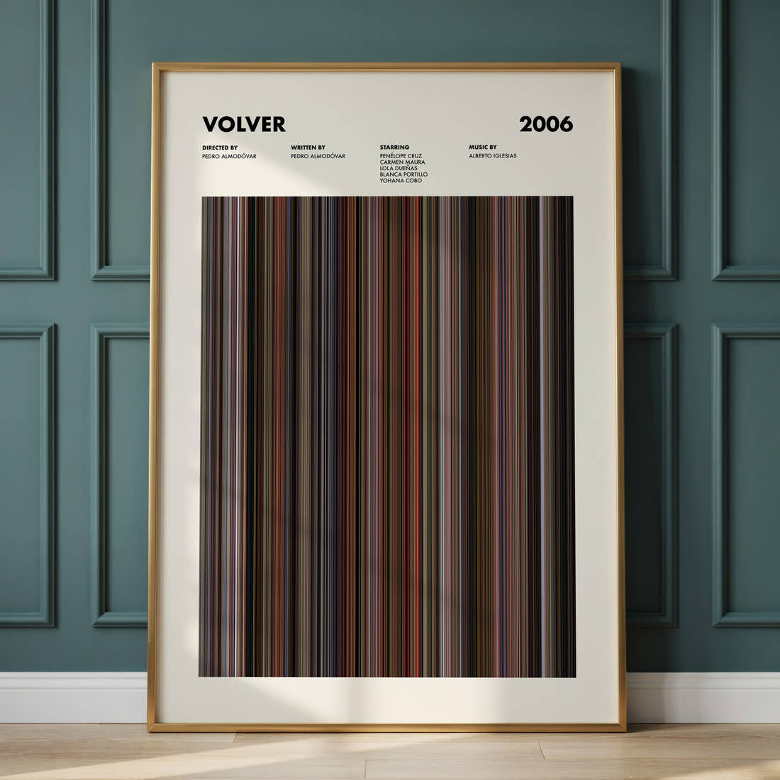 Volver Movie Barcode Poster framed and leaning against a panelled wall