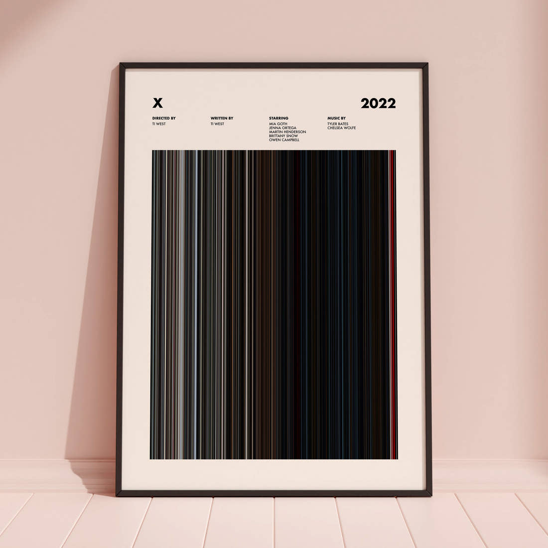 X Movie Barcode Poster framed and leaning against a coloured wall