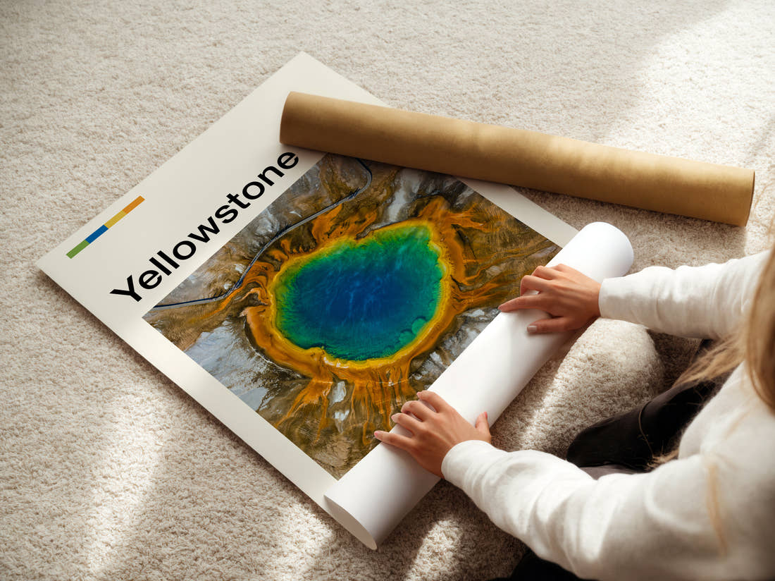 Yellowstone Grand Prismatic Spring Travel Print being unrolled from its postal tube