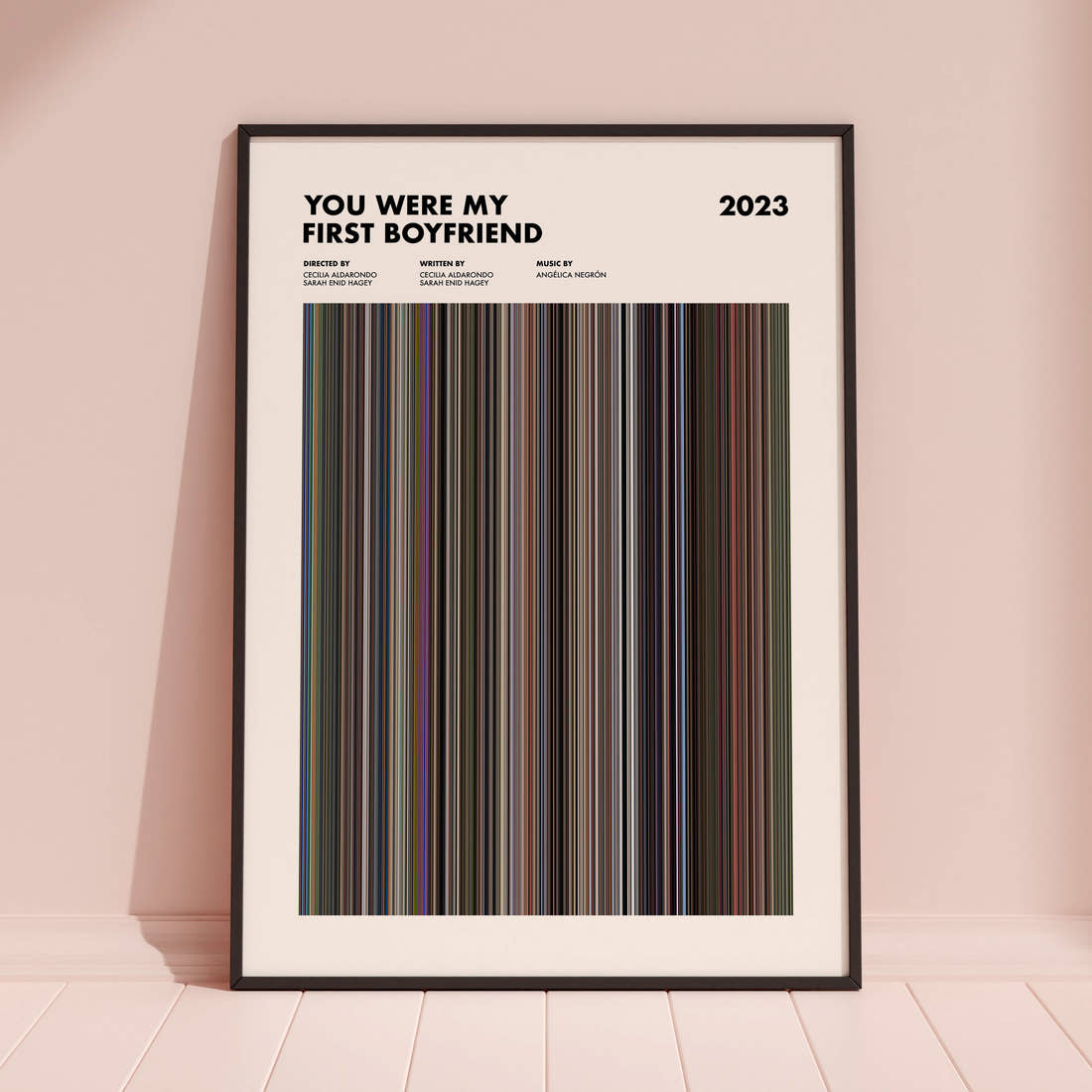 You Were My First Boyfriend Movie Barcode Poster framed and leaning against a coloured wall