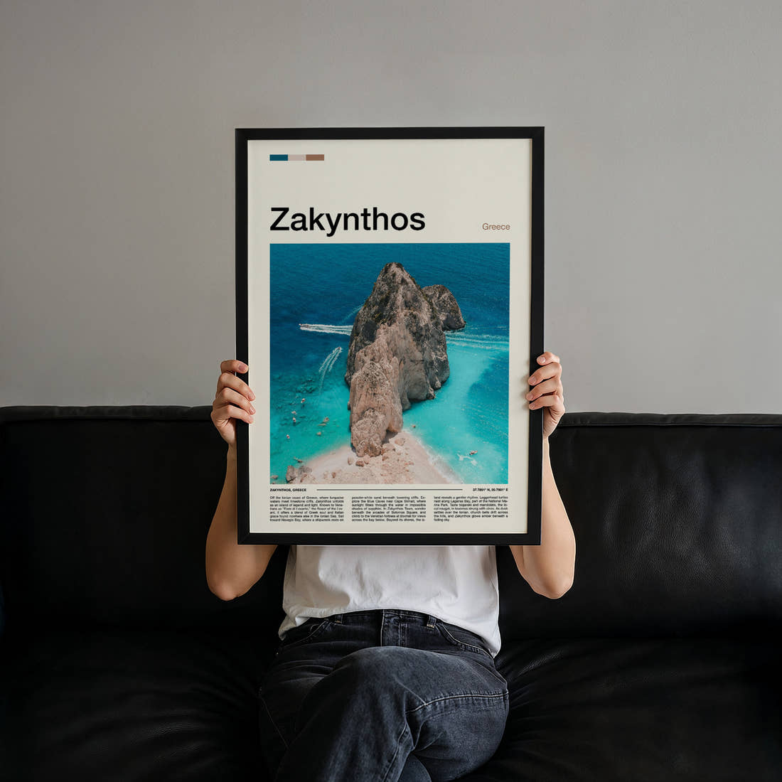 Zakynthos Aerial Rock Islet Travel Print held up by hand to show the size of the print